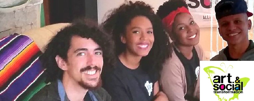 Four young artists smiling together.